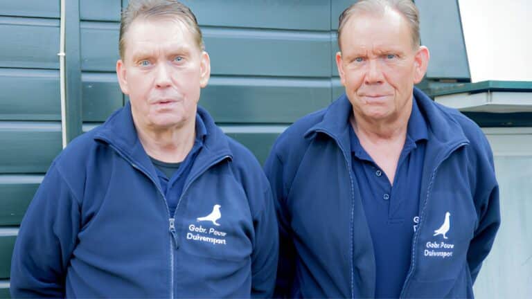 Joyful portrait of the Pouw brothers standing together in front of their backyard pigeon loft, celebrating their spectacular first place win against nearly ten thousand birds.