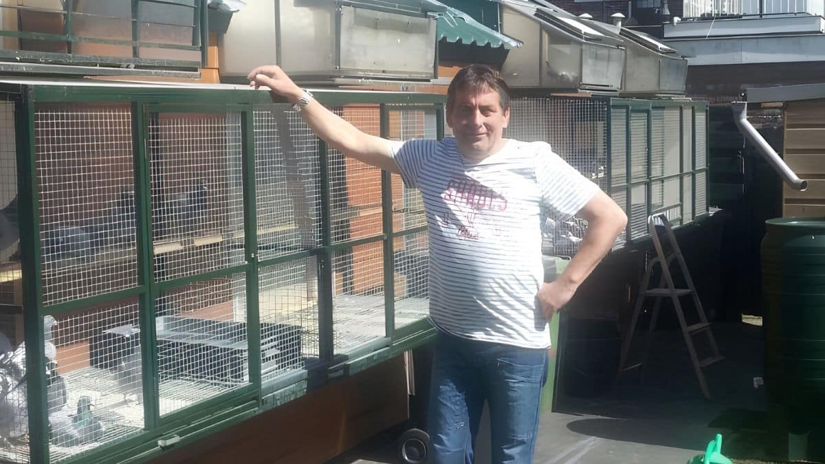 John Ruttenberg, the successful pigeon fancier behind the famous Ruttenberg Pigeons from Baarn, smiling proudly after celebrating a major victory in a prestigious racing event.